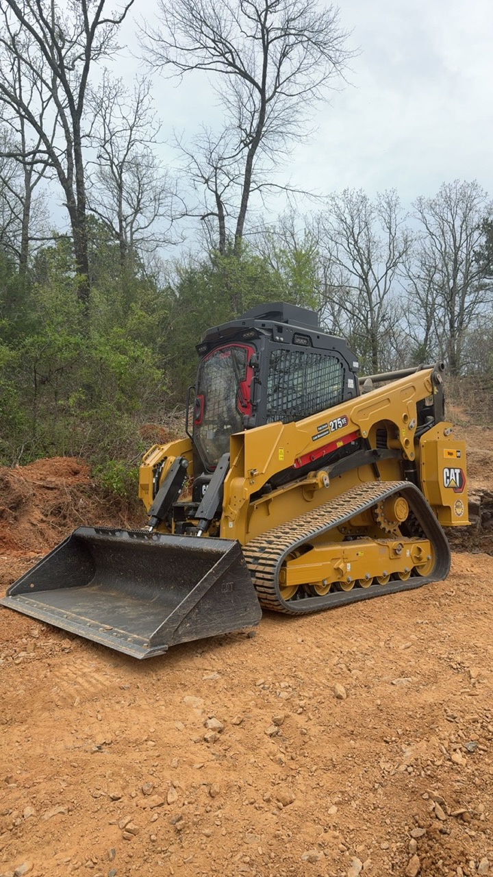 CAT 275 compact track loader on a freshly cleared job site